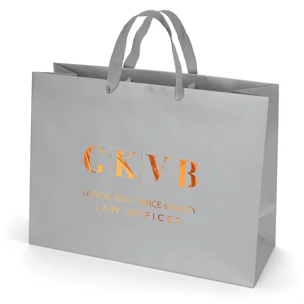 Premium-weight matte-laminated bag with woven handles and fold-over top.... from ASI 37940 Bag Makers Inc