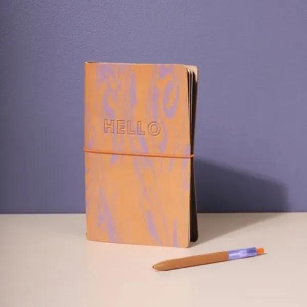 This sleek journal cover features an elastic closure to keep your... from ASI 74710 Numo