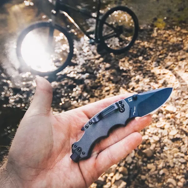 3.25" Glass-filled nylon textured handle. 2.4" drop point blade with black-oxide... from ASI 46170 Compass Industries Inc