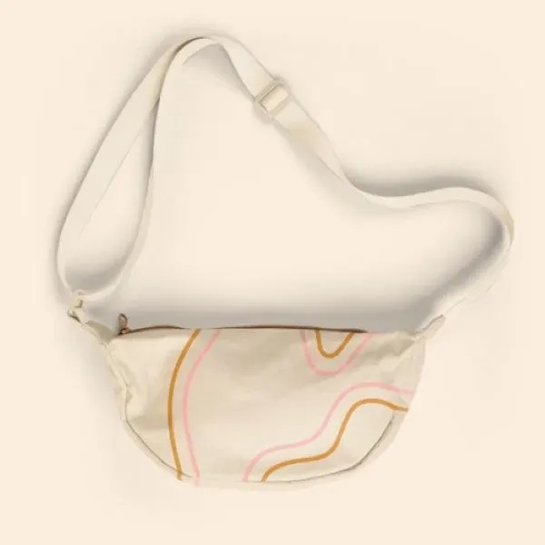 Our Crescent-shaped Luna Sling keeps your everyday essentials close, and your... from ASI 74710 Numo