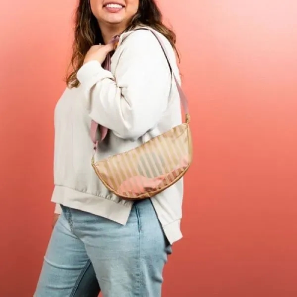 Our Crescent-shaped Luna Sling keeps your everyday essentials close, and your... from ASI 74710 Numo