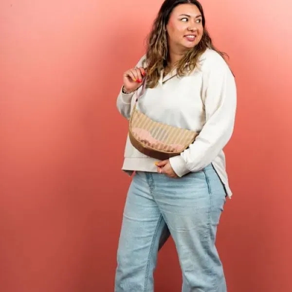 Our Crescent-shaped Luna Sling keeps your everyday essentials close, and your... from ASI 74710 Numo