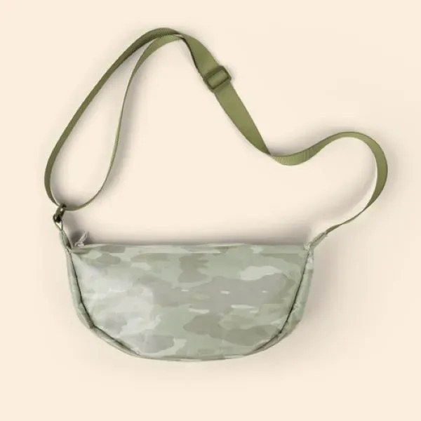 Our Crescent-shaped Luna Sling keeps your everyday essentials close, and your... from ASI 74710 Numo