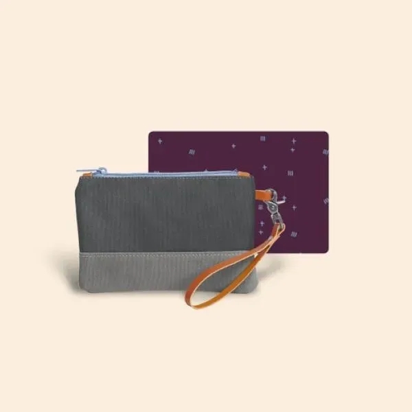 Wristlet with canvas exterior and smooth pull nylon zipper... from ASI 74710 Numo / City Cut & Sew