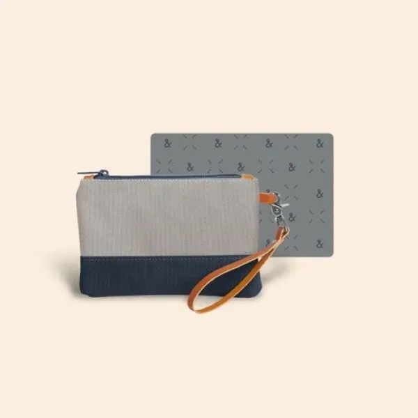 Wristlet with canvas exterior and smooth pull nylon zipper... from ASI 74710 Numo / City Cut & Sew