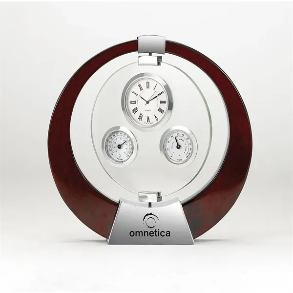 Desk clock designed with gimbaled movement and features a thermometer and... from ASI 68507 The Magnet Group / Benchmark Crystal & Clocks