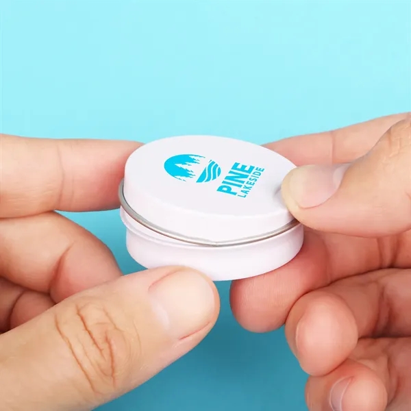 Press-to-open lip moisturizer tin with indentation on the lid.... from ASI 61966 HPG / Mixie