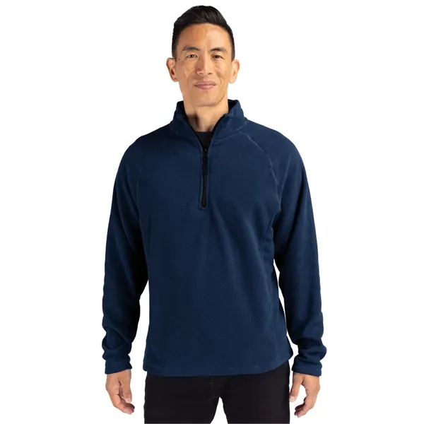 Men's jacket with a half-zip, self-fabric mock neck, two front zippered... from ASI 47965 Cutter & Buck
