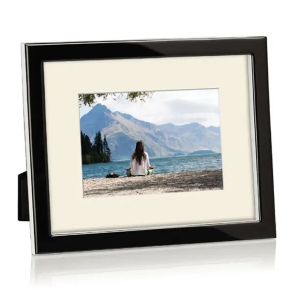 Molded ebony Lucite, polished to an ultra glossy shine, surrounds a... from ASI 84592 St Regis Group