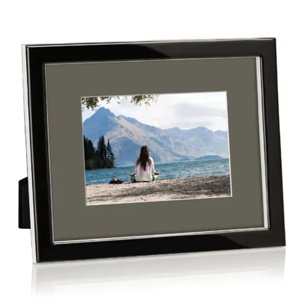 Molded ebony Lucite, polished to an ultra glossy shine, surrounds a... from ASI 84592 St Regis Group