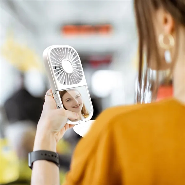 A Multi-functional wearable foldable fan with mirror... from ASI 91435 Tomax USA