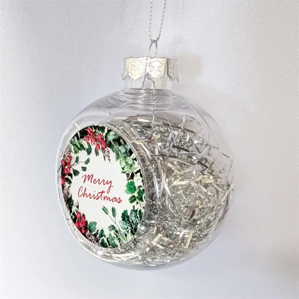 Round hanging tassle filled plastic ornament with sublimated front logo.... from ASI 76797 Pelican Graphics / Pelican Lures