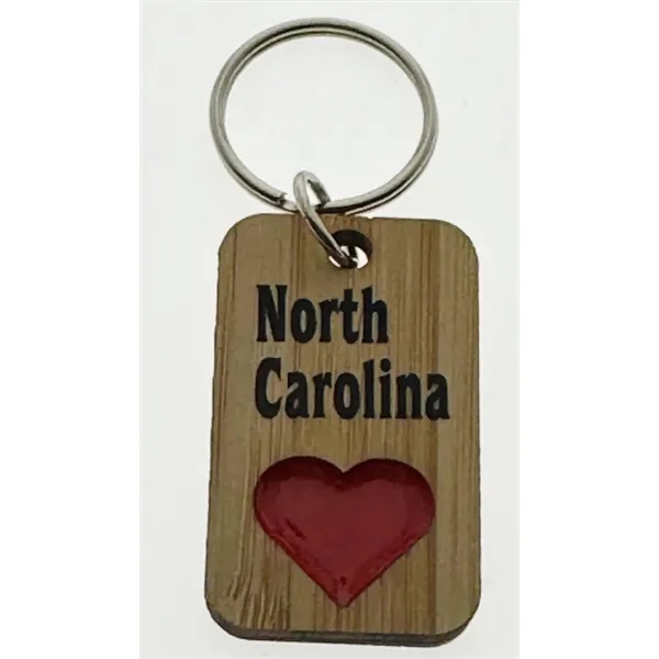 2-layer rectangular keychain with soft enamel bear, moose, or heart designs.... from ASI 40610 Perry Blackburne Inc