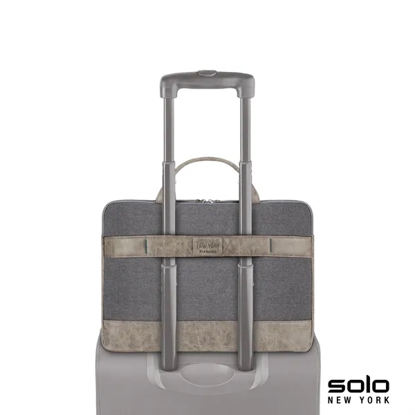 Solo Pilot two-tone slim brief; includes turquoise lining and protects laptops... from ASI 67866 Logomark/Valumark