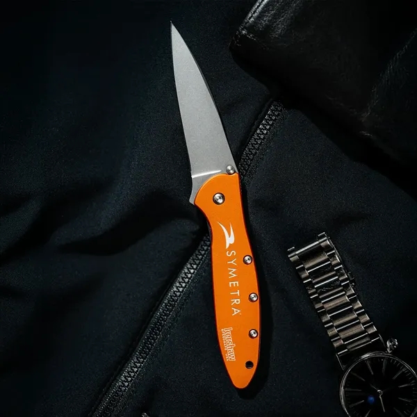 Folding knife in orange with 4" blade and a patented operating... from ASI 46170 Compass Industries Inc