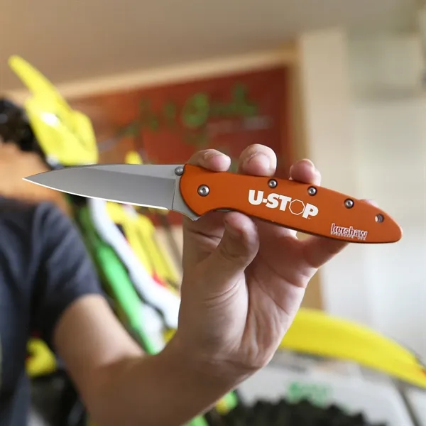 Folding knife in orange with 4" blade and a patented operating... from ASI 46170 Compass Industries Inc