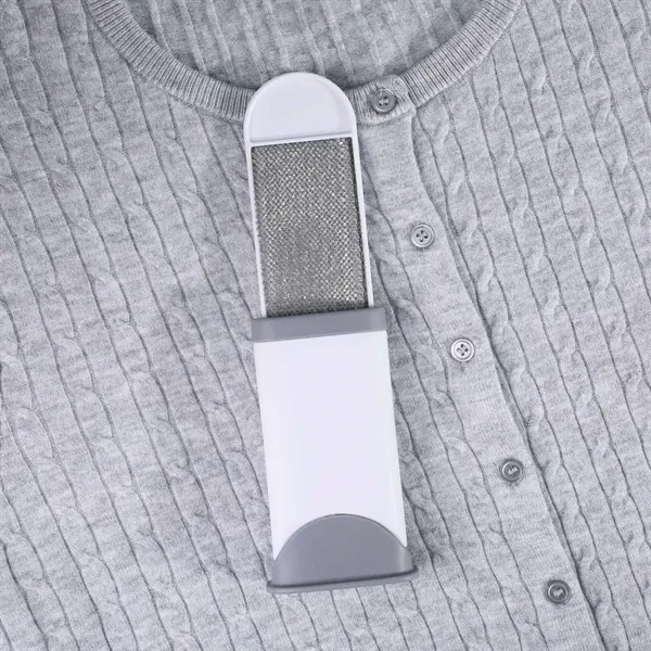 Double sided travel sized lint remover with self cleaning base. Double... from ASI 61966 HPG / Mixie