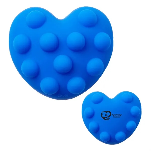 Heart-shaped silicone fidget ball with push-pop, dimpled surface.... from ASI 63549 Jornik Manufacturing Corp