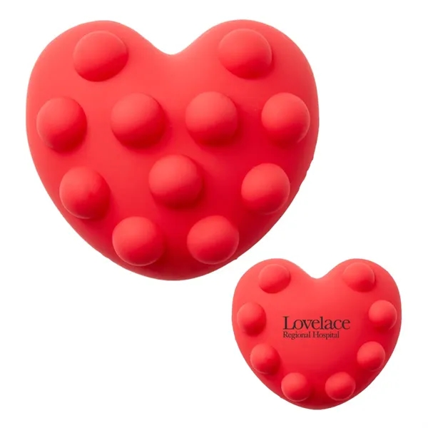 Heart-shaped silicone fidget ball with push-pop, dimpled surface.... from ASI 63549 Jornik Manufacturing Corp
