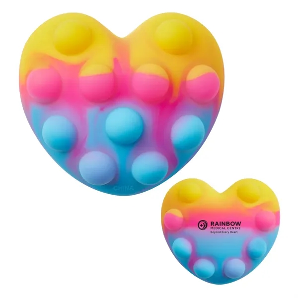 Heart-shaped silicone fidget ball with push-pop, dimpled surface.... from ASI 63549 Jornik Manufacturing Corp