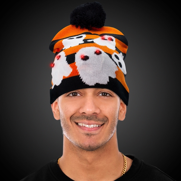 Knit hat with a black pom pom, black and orange striped... from ASI 42016 Brighter Promotions Inc