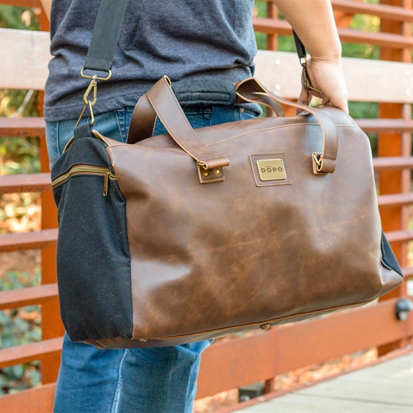Leather duffle comes with handles, shoulder strap, 35-liter capacity, secure zippered... from ASI 61966 HPG / OrigAudio
