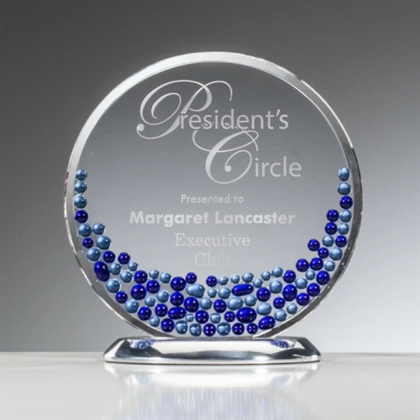 Starfire crystal disk is complimented by a mosaic of sapphire and... from ASI 84592 St Regis Group / R S Owens & Co Inc