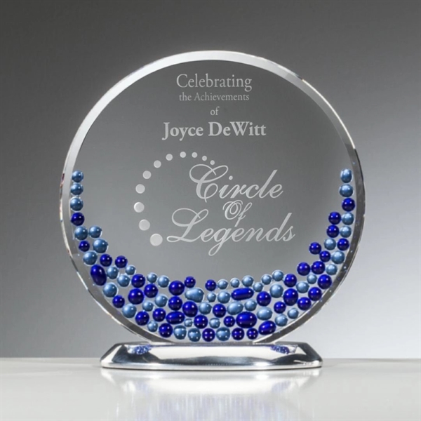 Starfire crystal disk is complimented by a mosaic of sapphire and... from ASI 84592 St Regis Group / R S Owens & Co Inc
