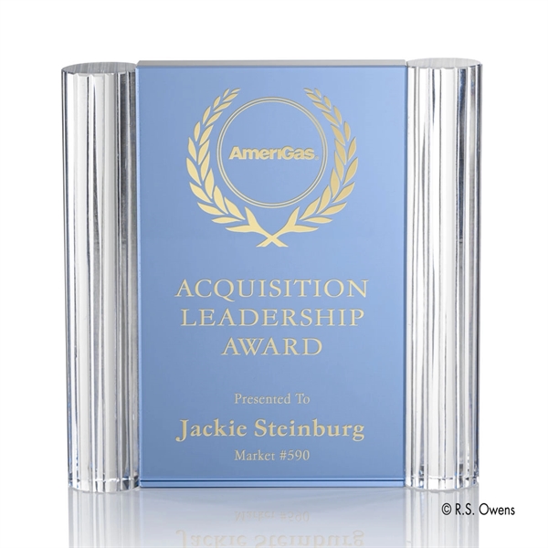 Thick aqua blue optical crystal is cut into rectangles and surrounded... from ASI 84592 St Regis Group / R S Owens & Co Inc