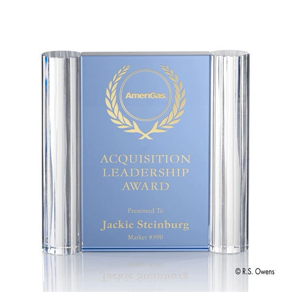 Thick aqua blue optical crystal is cut into rectangles and surrounded... from ASI 84592 St Regis Group / R S Owens & Co Inc