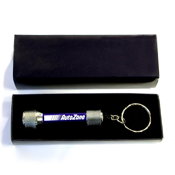 Super bright LED flashlight with keychain and gift case... from ASI 74585 Nu Promo International / Nu Promo Line